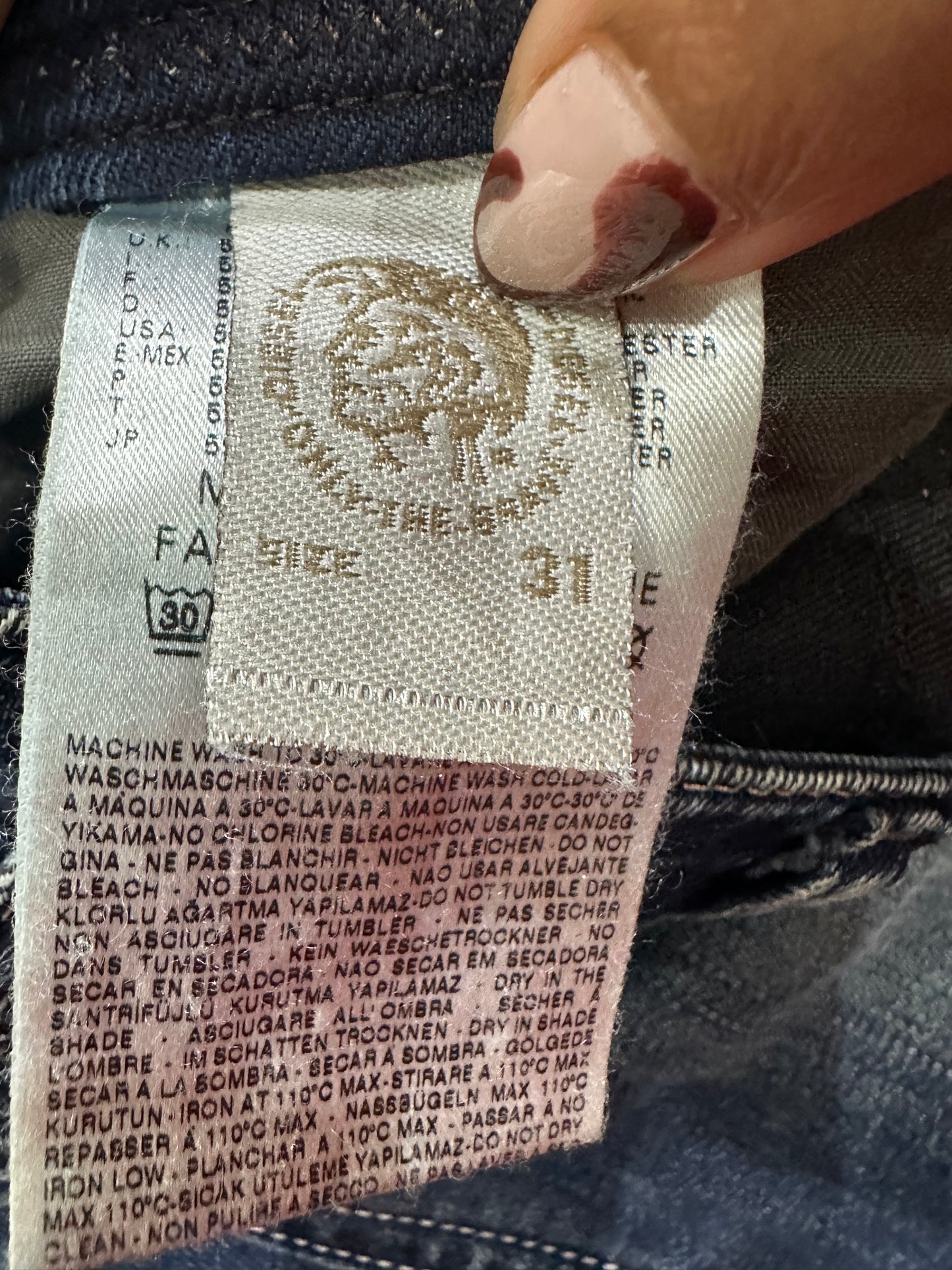 midsummer edit | medium blue diesel bootcut jeans with faux leather detail