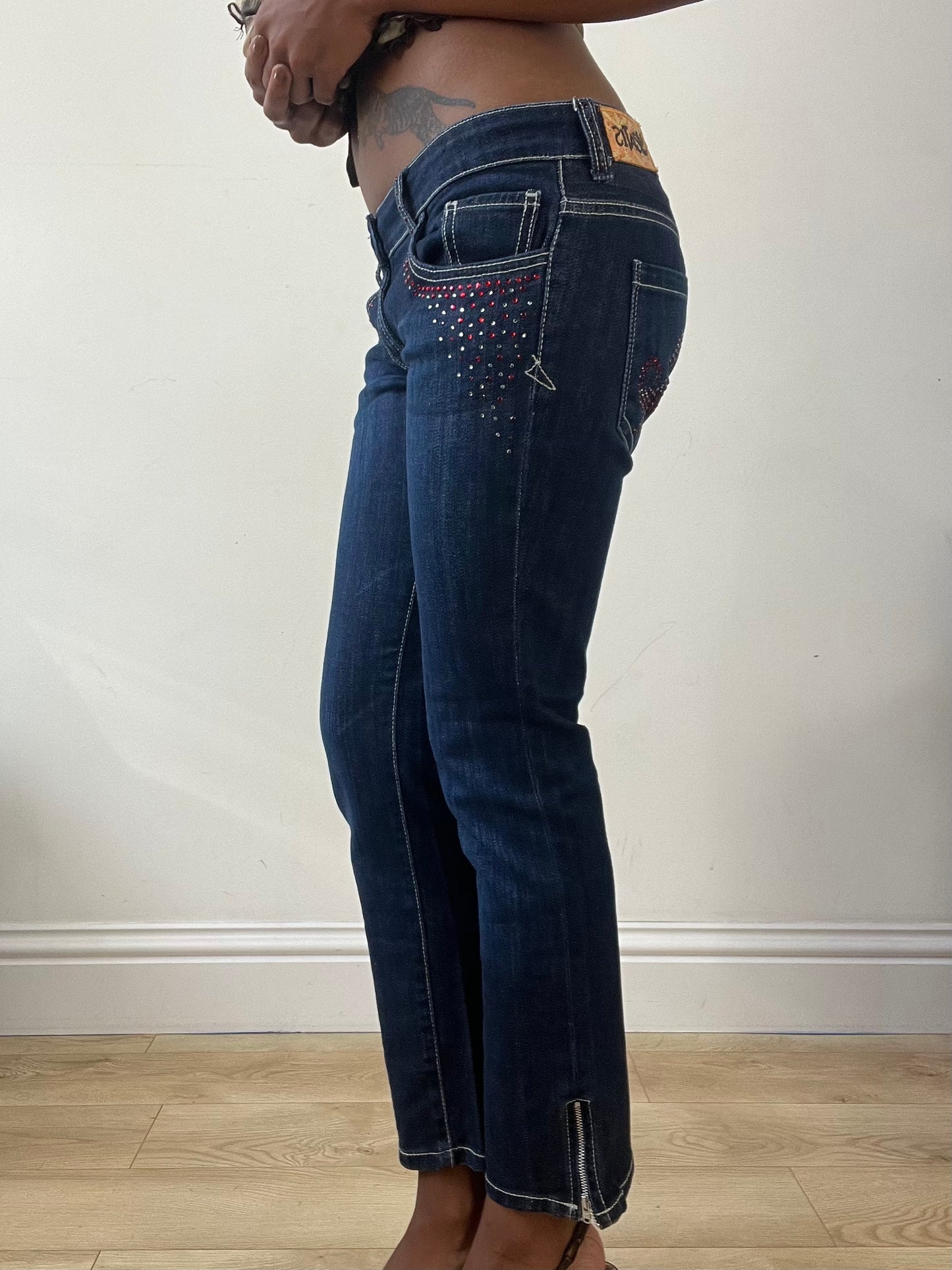 BEST PICKS | small blue denim bootcut jeans with rhinestone details