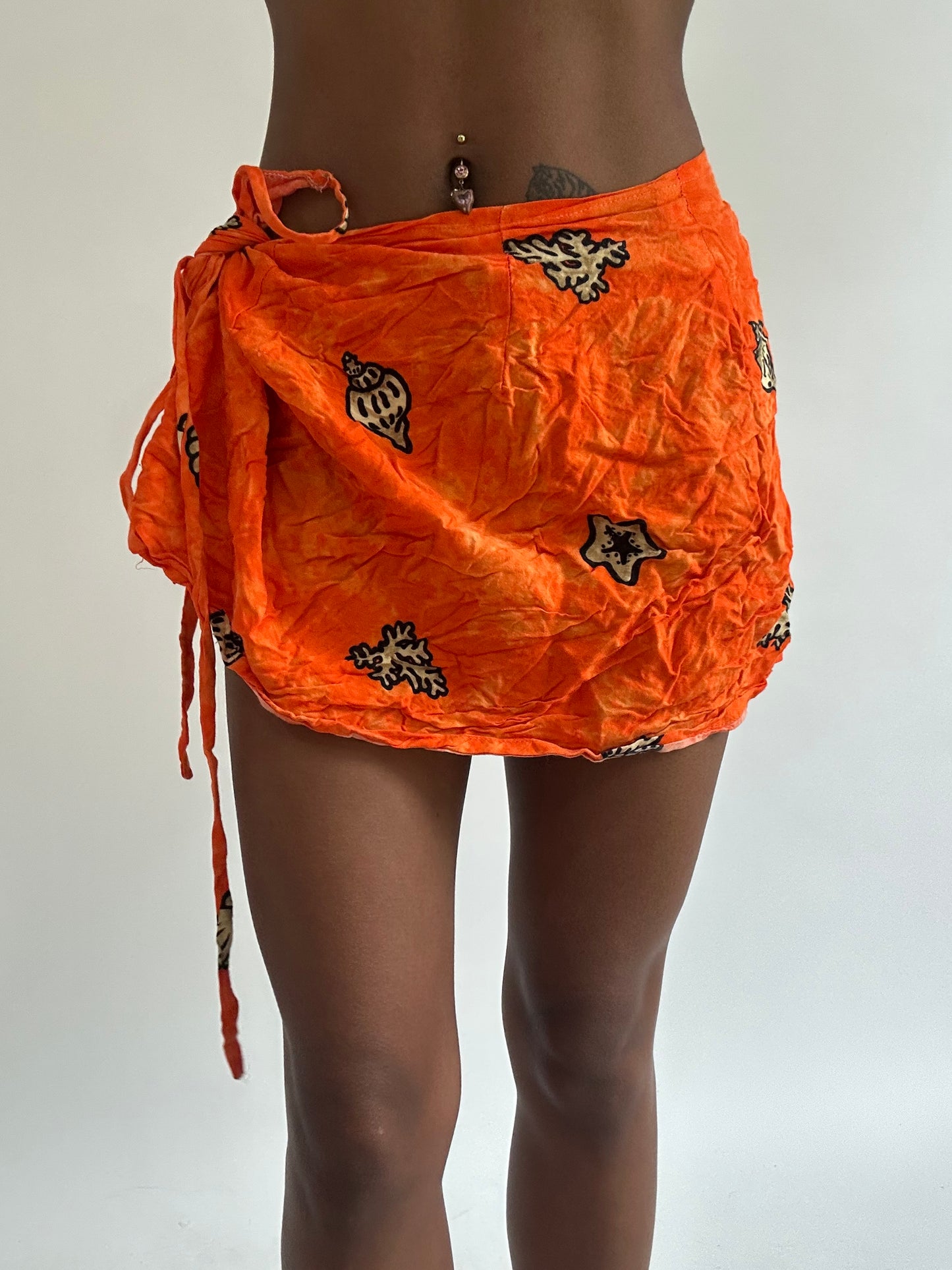 BEST PICKS | small orange patterned beach wrap skirt