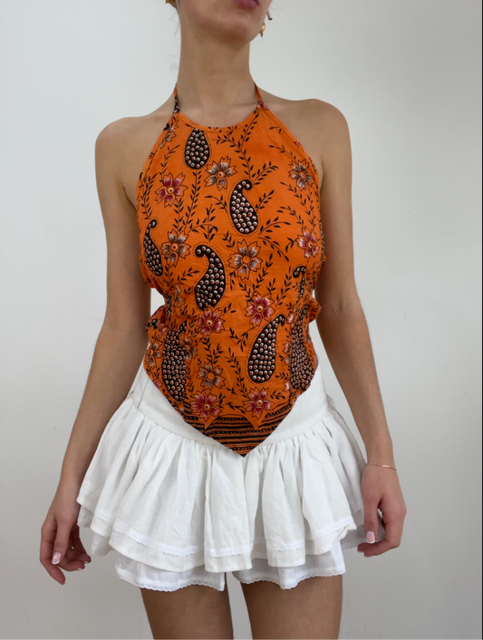 color: naranja · prenda: top · detalles: cachemira + asimétrico + espalda descubierta + detalle + 💻 + ‼️
