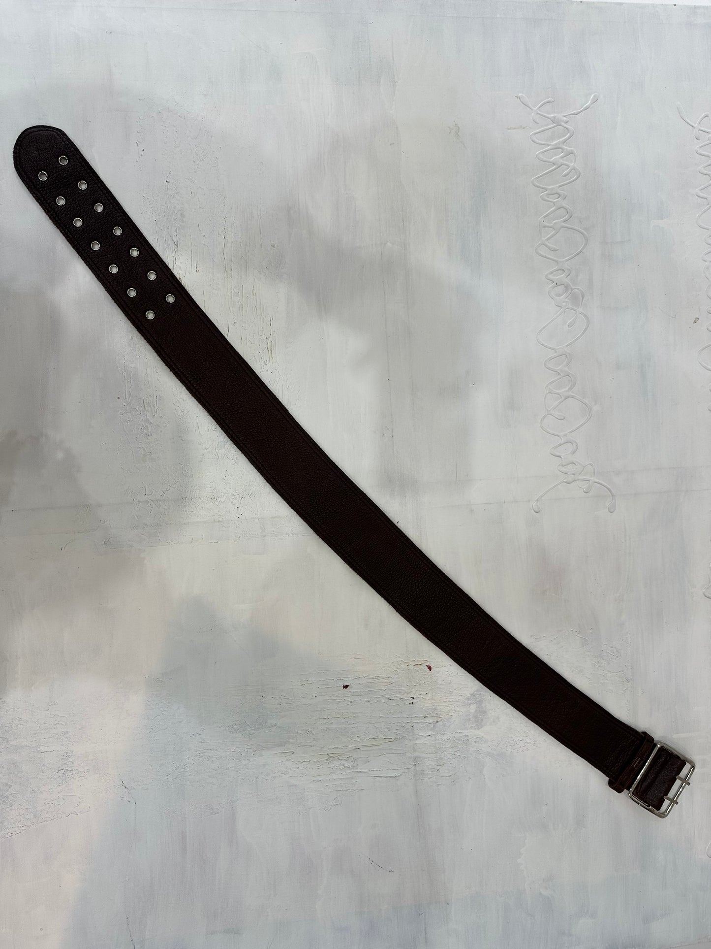 BEST PICKS | brown faux leather belt with silver eyelet detail