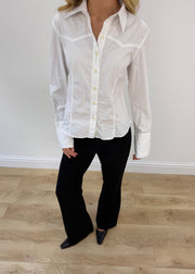 small white button up long sleeve shirt