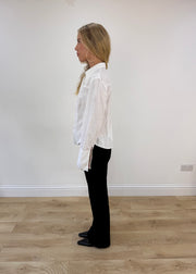 small white button up long sleeve shirt