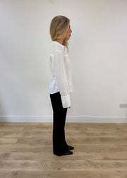 small white button up long sleeve shirt