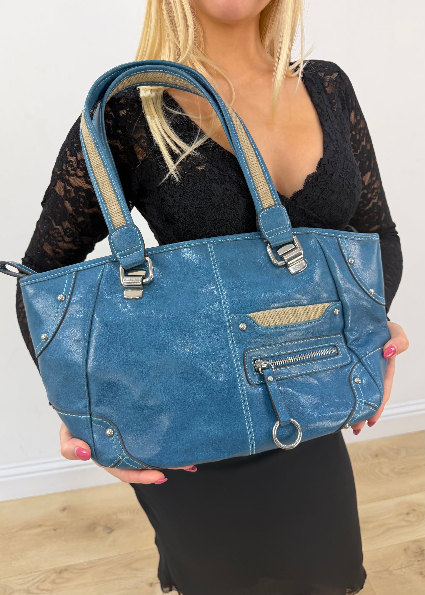 blue shoulder tote bag with silver hardware detail view