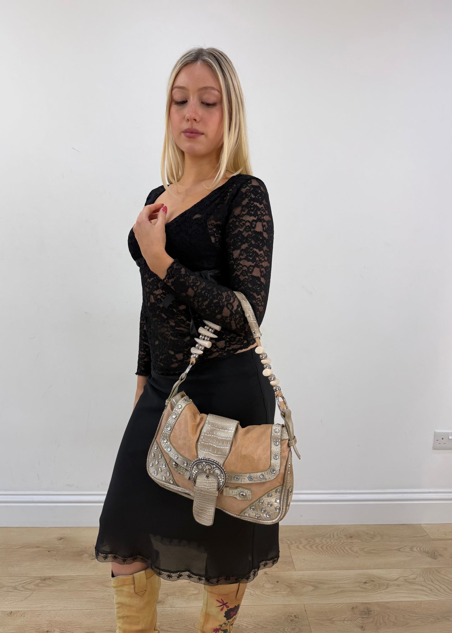 tan embellished shoulder bag with rhinestone buckle detail view
