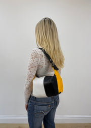 black white and yellow colour block shoulder bag detail view