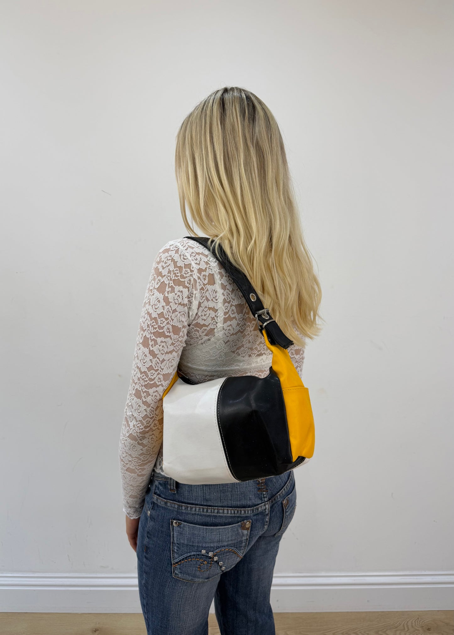 black white and yellow colour block shoulder bag detail view