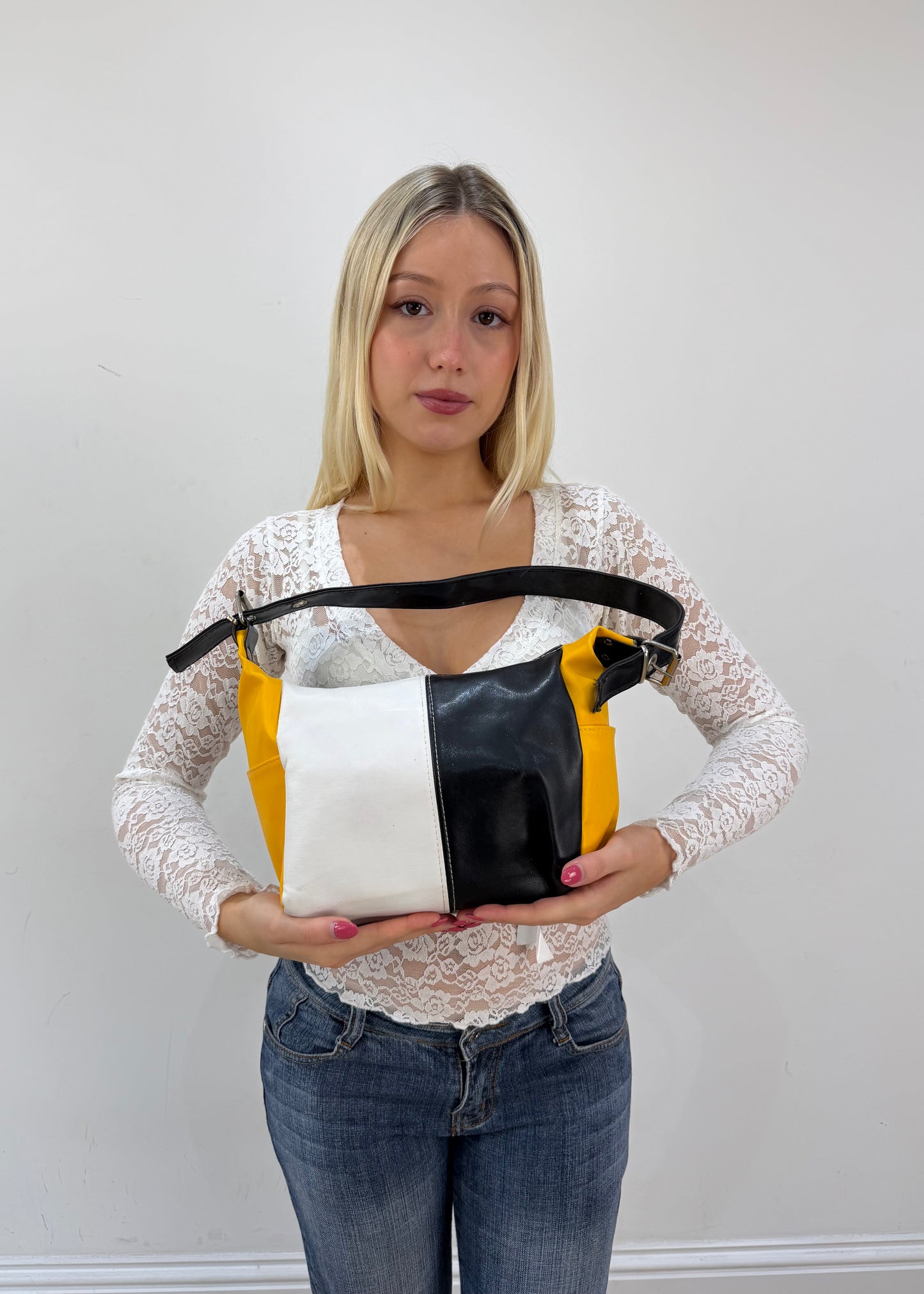 black white and yellow colour block shoulder bag detail view