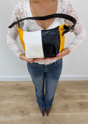black white and yellow colour block shoulder bag front view