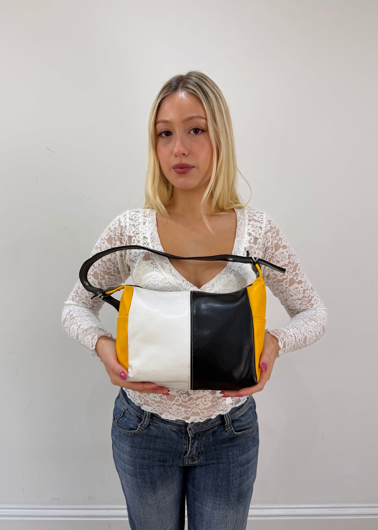 black white and yellow colour block shoulder bag detail view