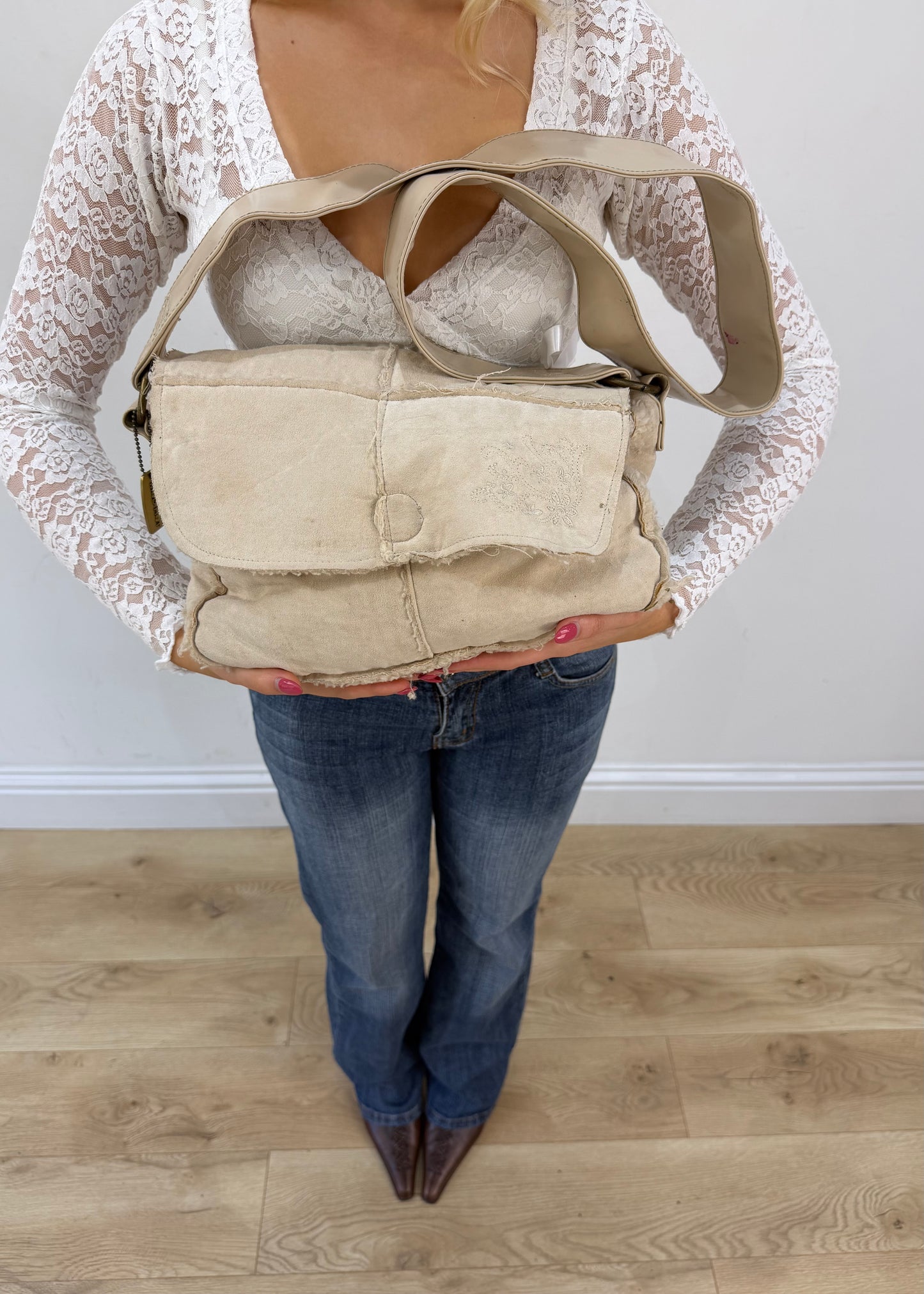 white structured shoulder bag with metallic details front view