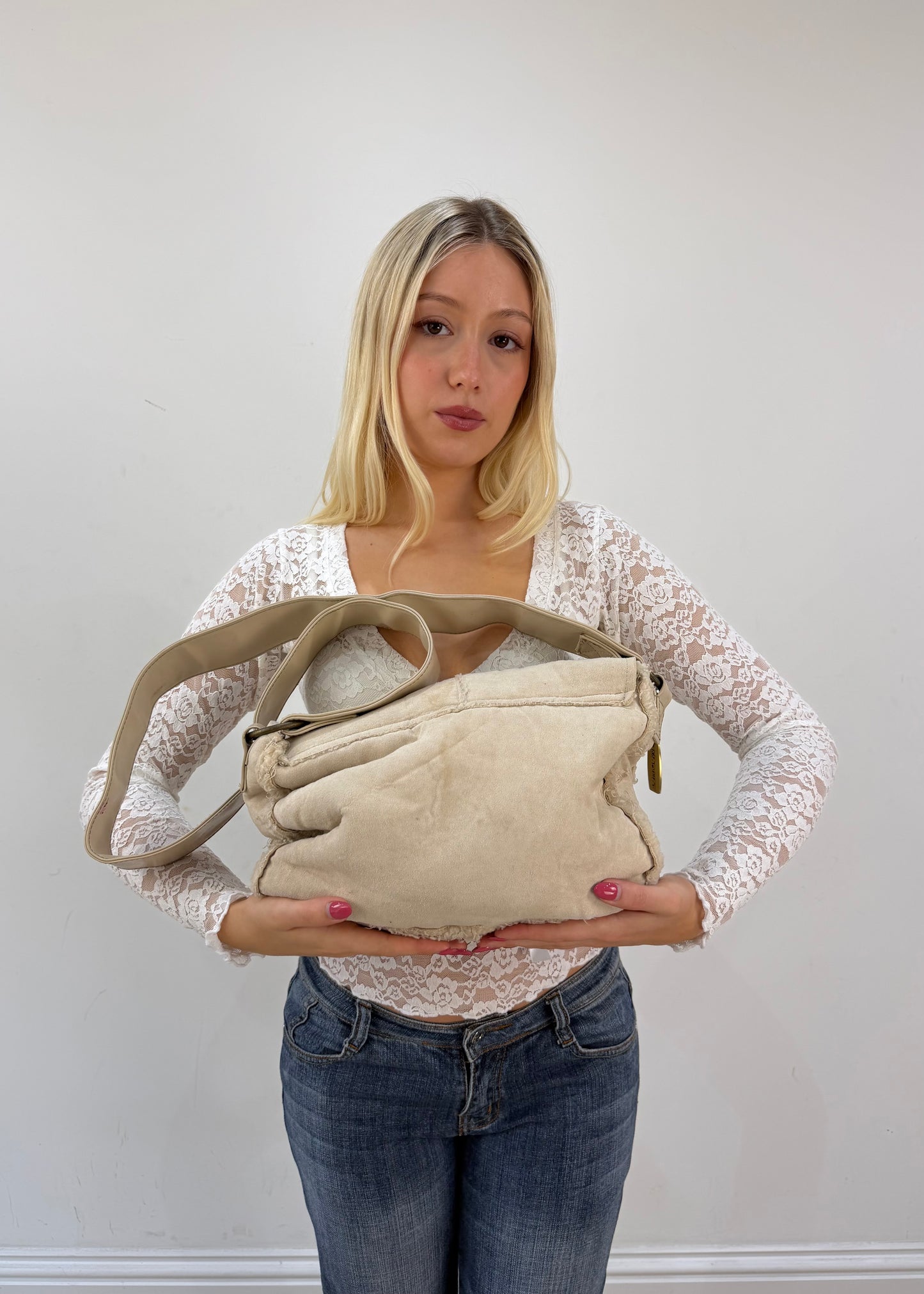 white structured shoulder bag with metallic details detail view