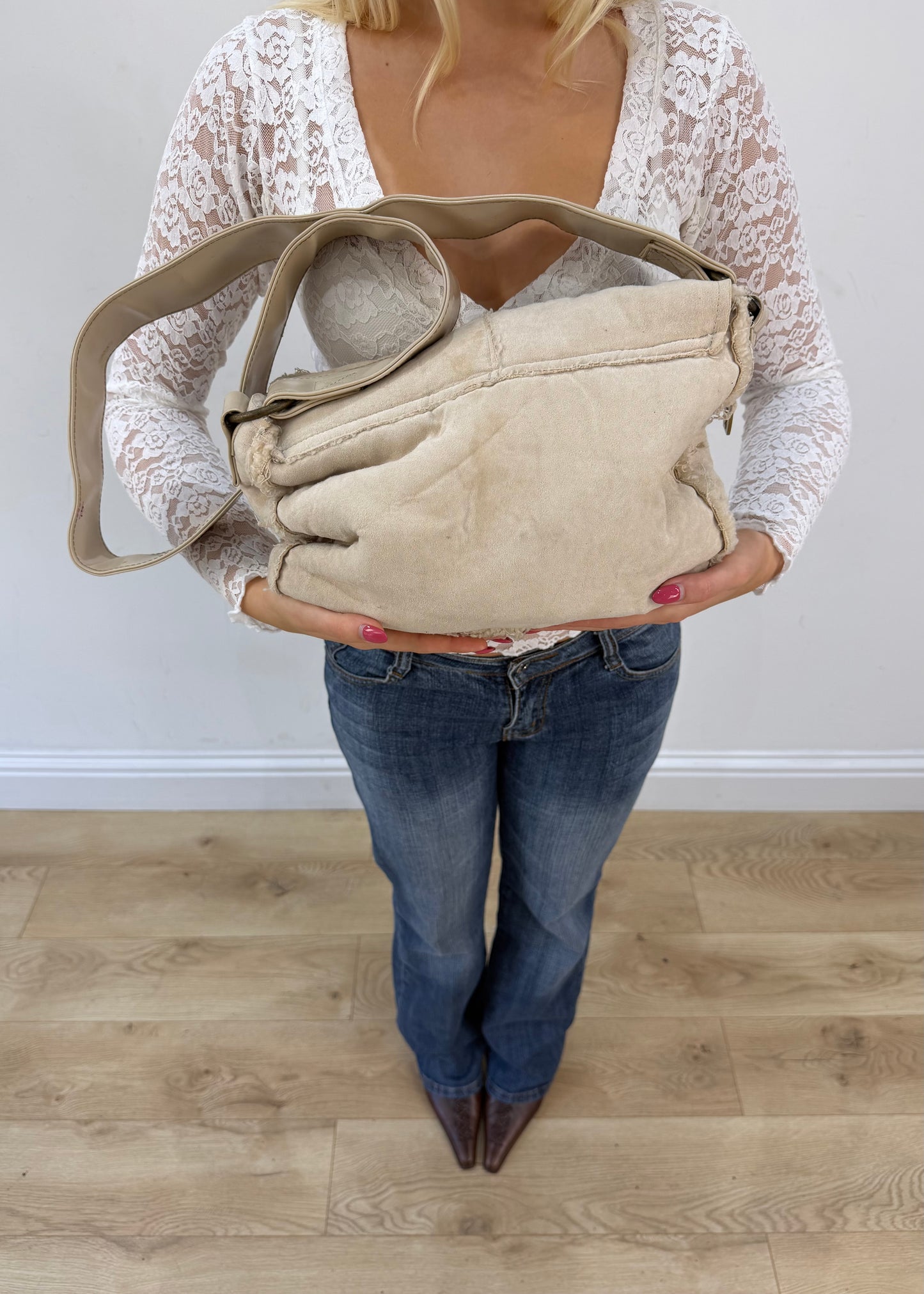 white structured shoulder bag with metallic details detail view