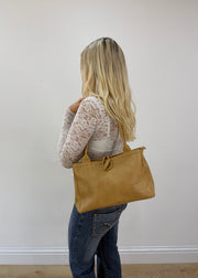 mustard yellow shoulder bag detail view