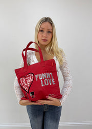 red graphic slogan tote bag detail view
