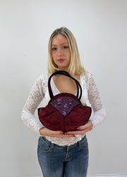 burgundy rounded handbag detail view