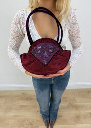 burgundy rounded handbag front view