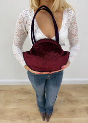 burgundy rounded handbag detail view