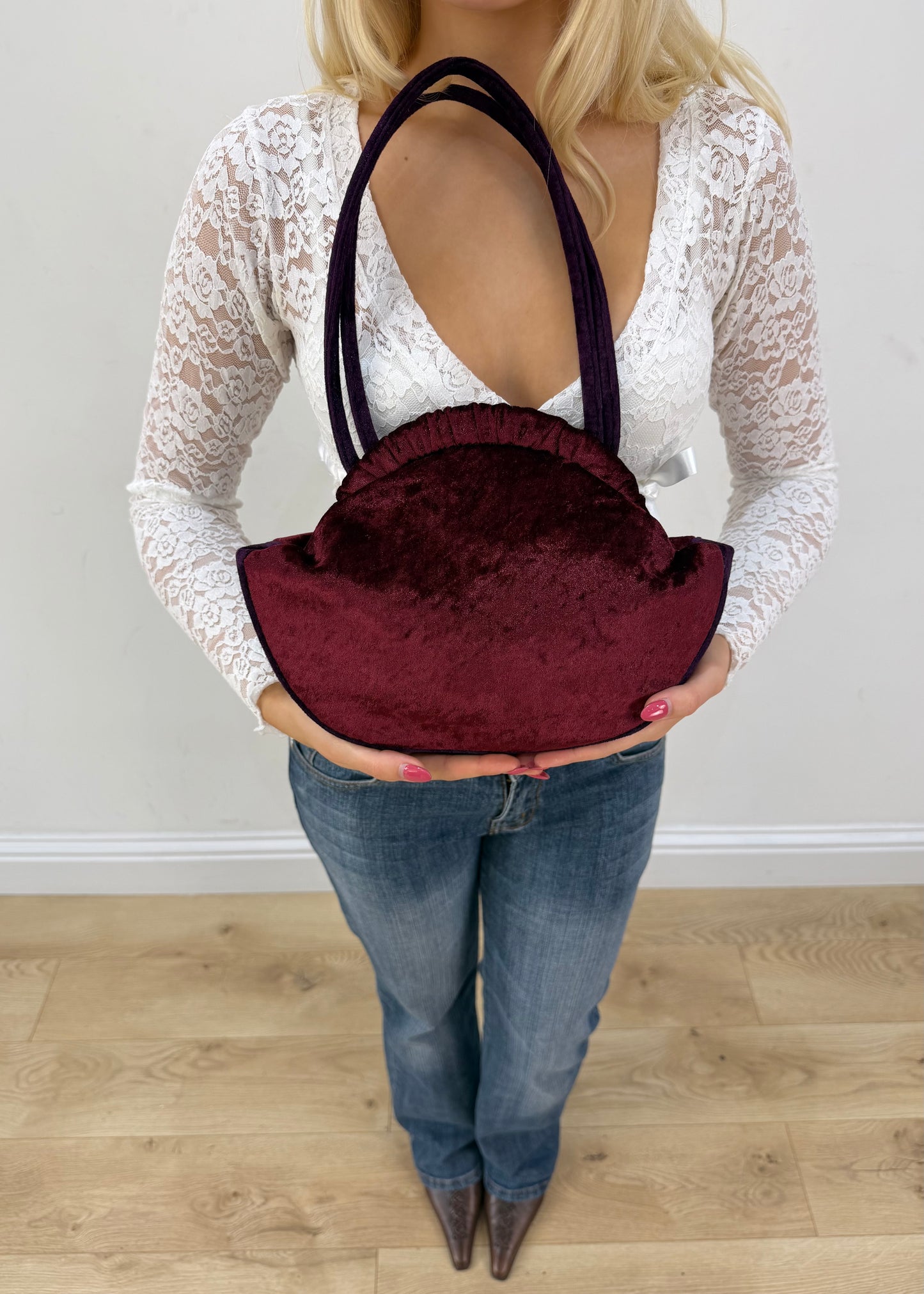 burgundy rounded handbag detail view