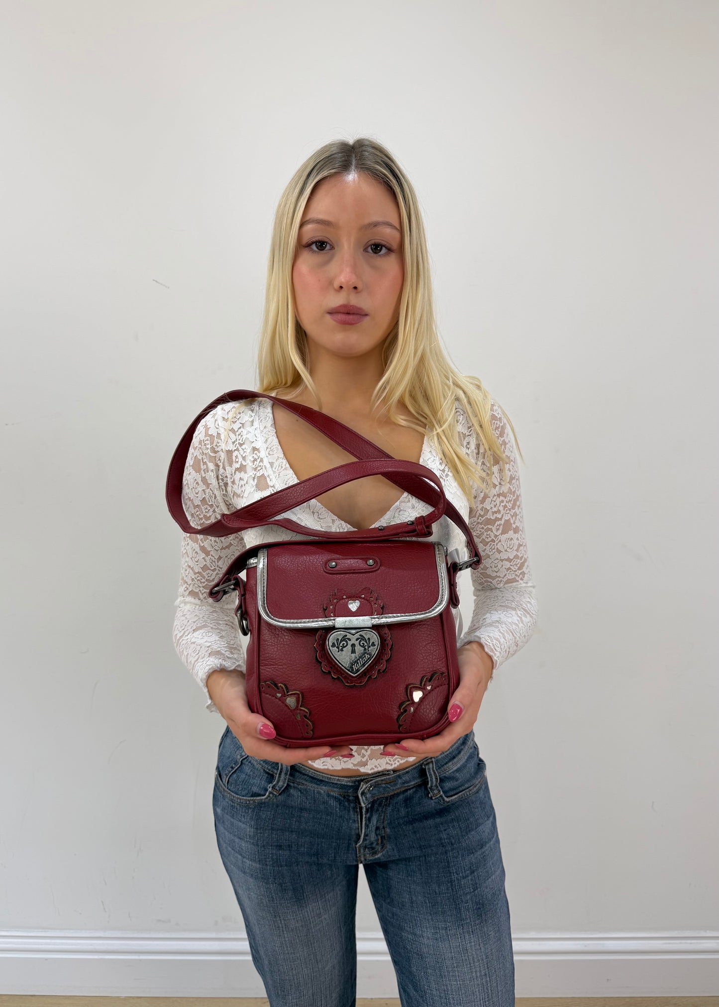 burgundy rounded mini handbag detail view