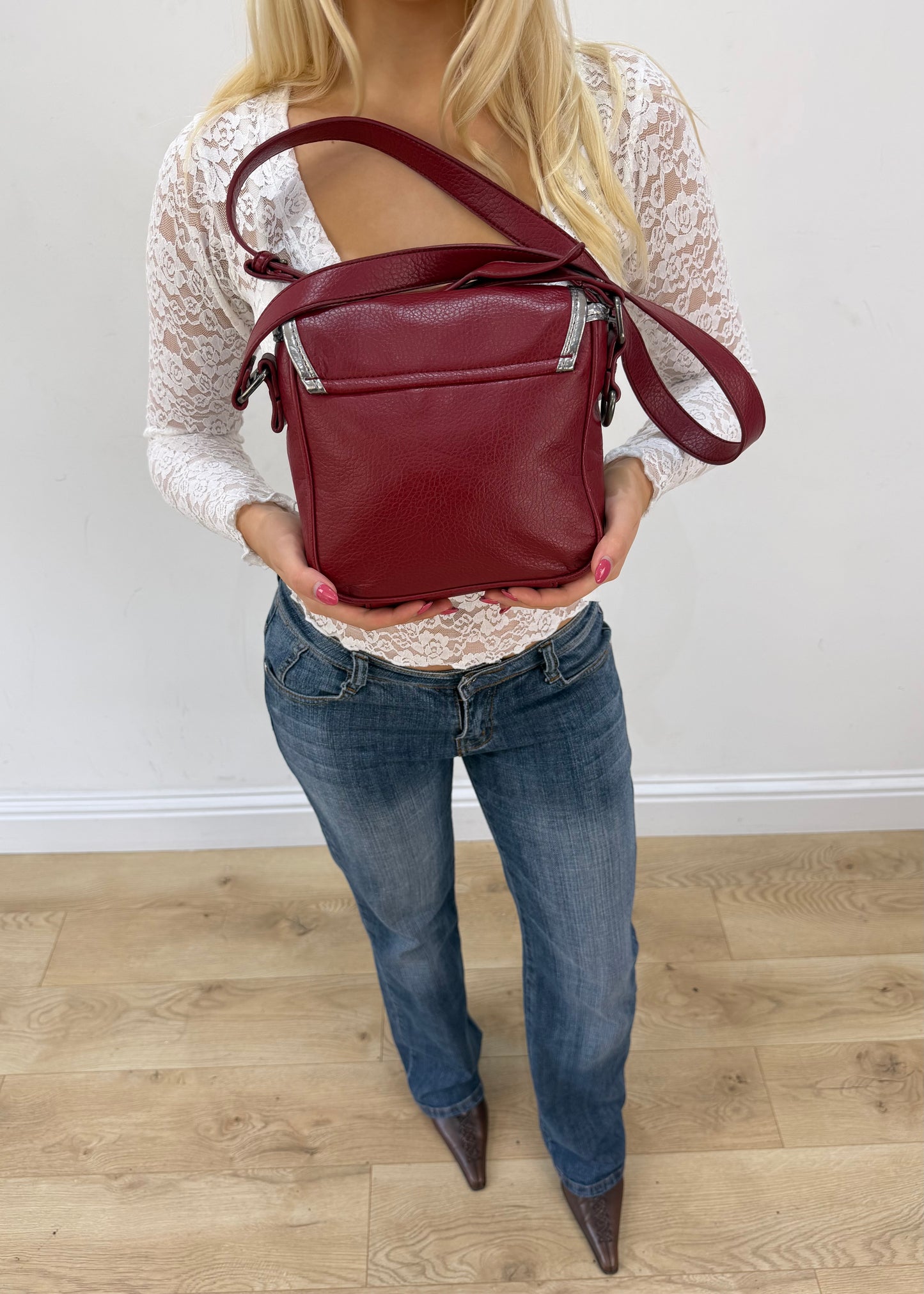 burgundy rounded mini handbag detail view