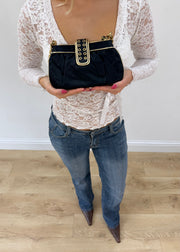 black mini bag with gold buckle detail view