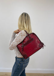 red structured satchel bag detail view