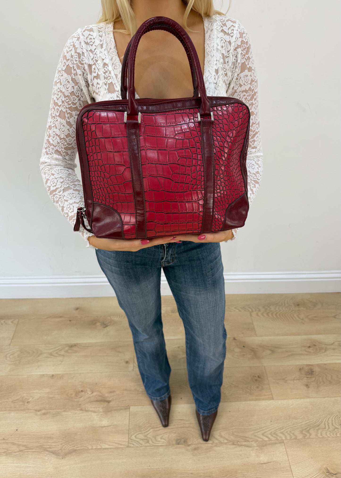 red structured satchel bag detail view
