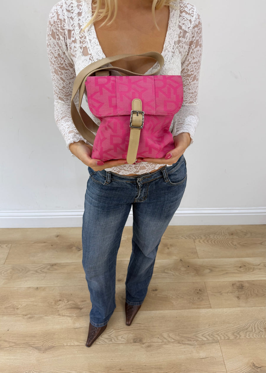 bright pink mini bag with buckle detail front view
