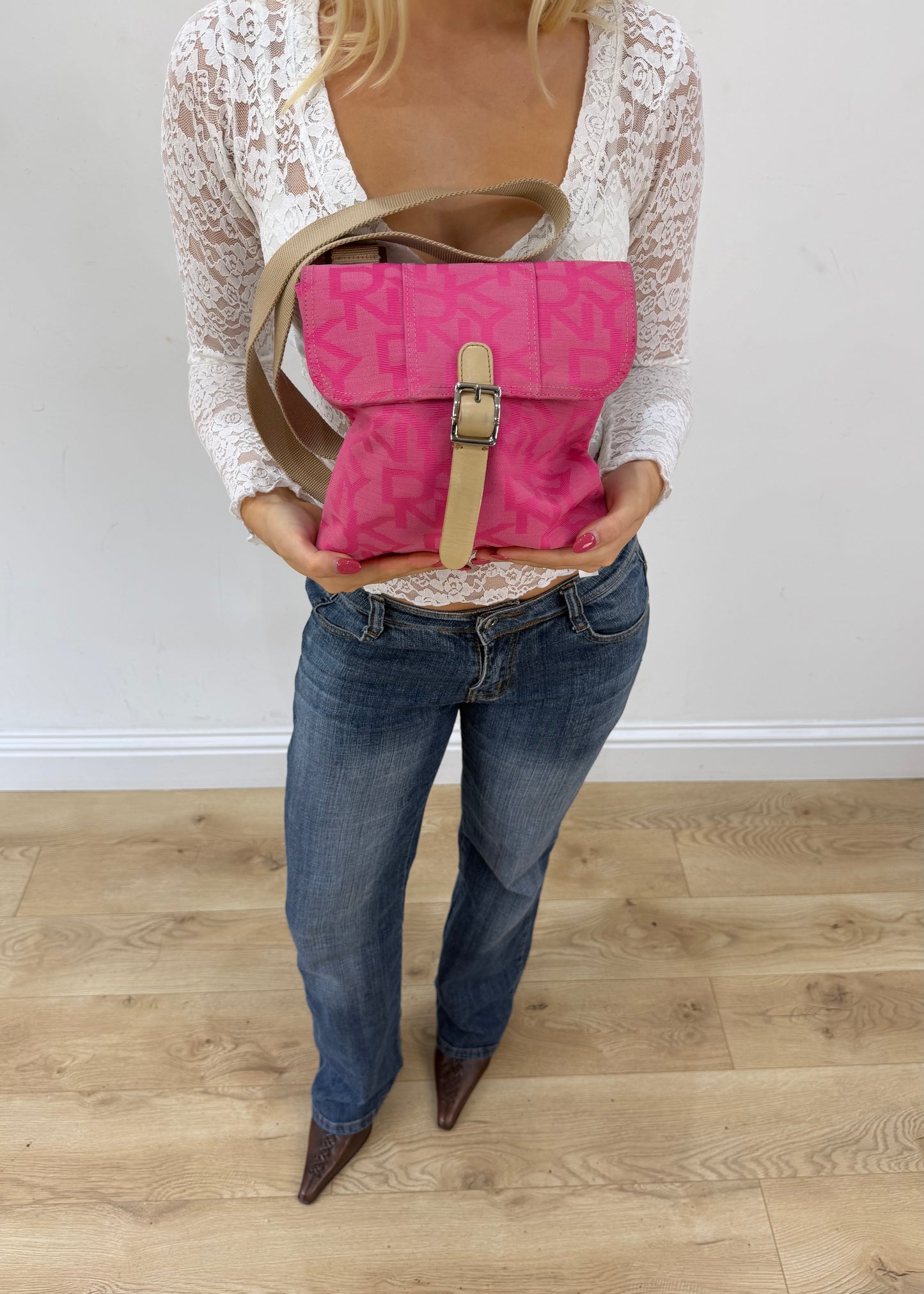 bright pink mini bag with buckle detail front view