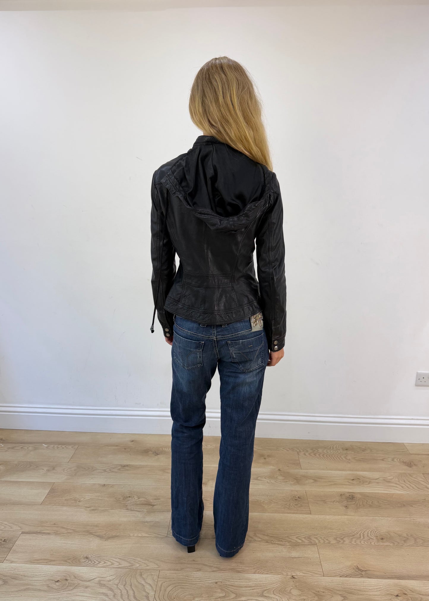 small black faux leather jacket with detachable hood - back view