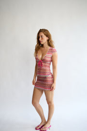 Model wearing the Allegra Dress in Candyfloss Pink – three-quarter view