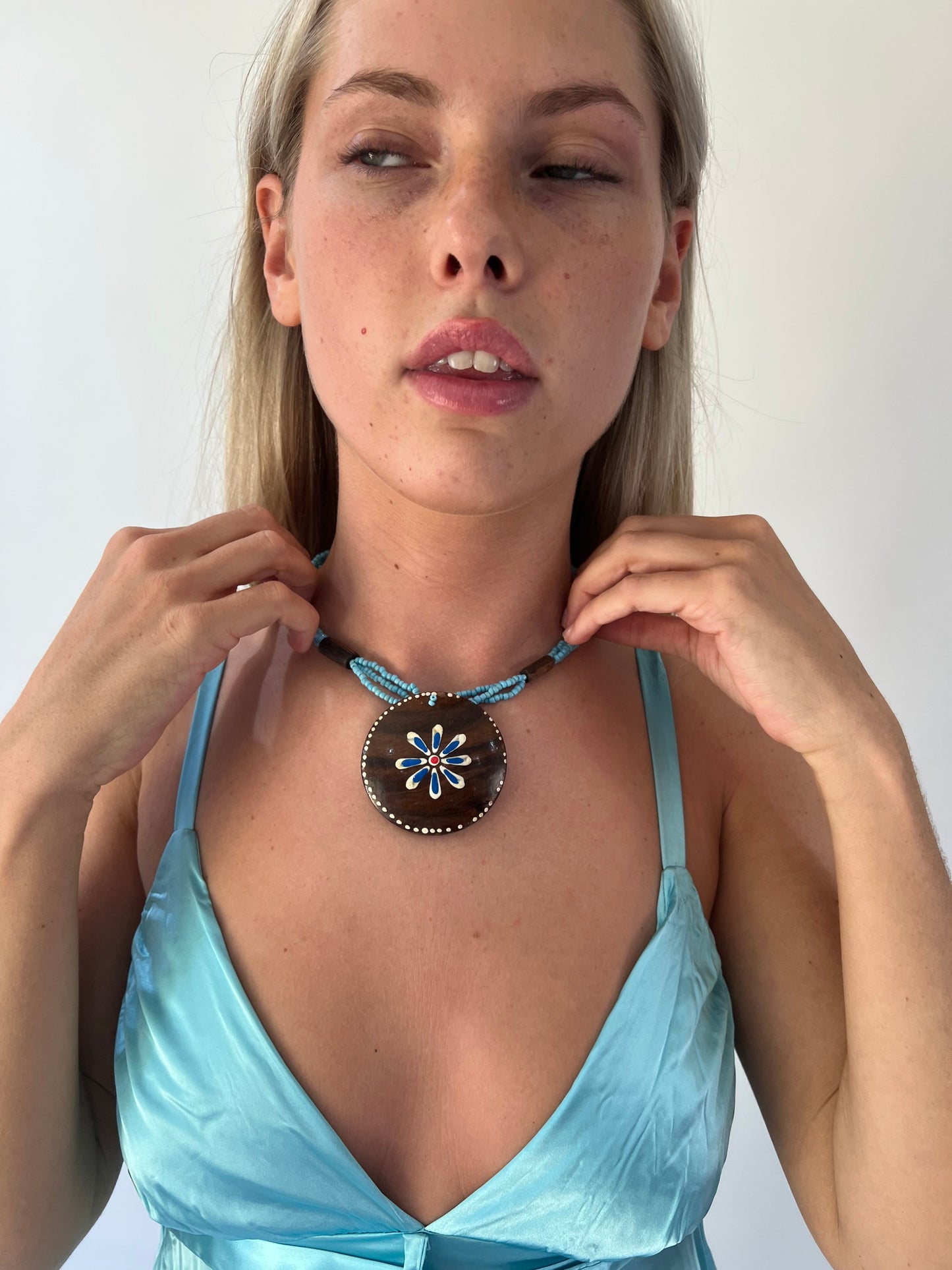 aquamarine drop | one size turquoise beaded wooden flower necklace