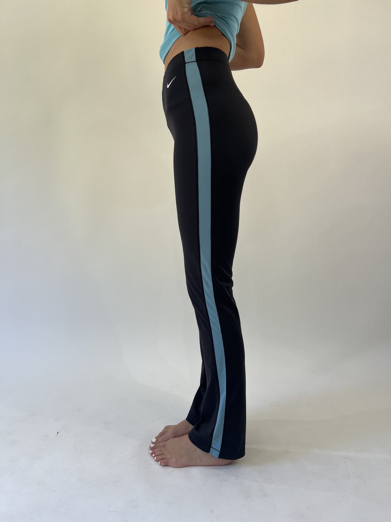 aquamarine drop | small black nike track pants with blue stripe