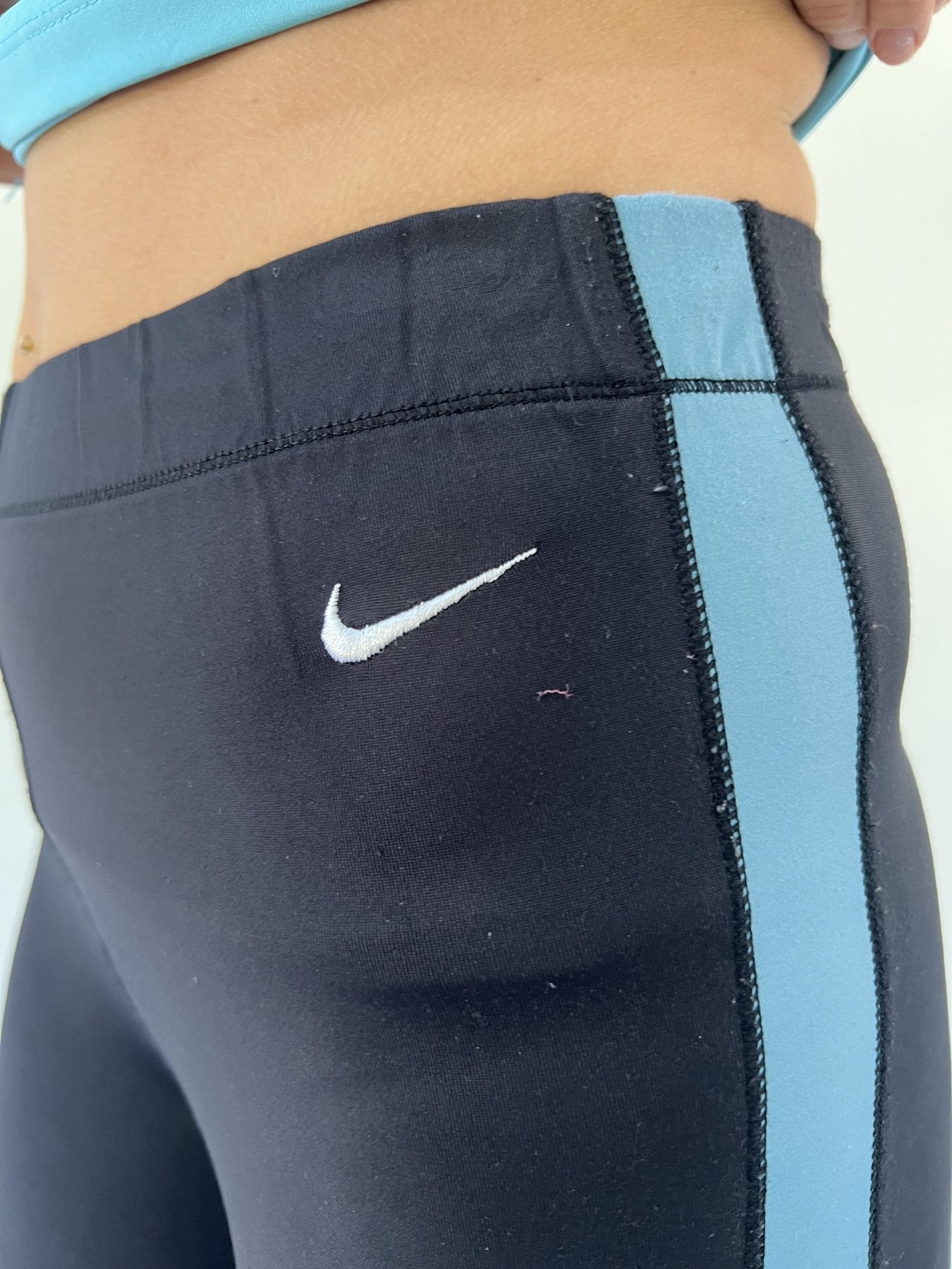 aquamarine drop | small black nike track pants with blue stripe
