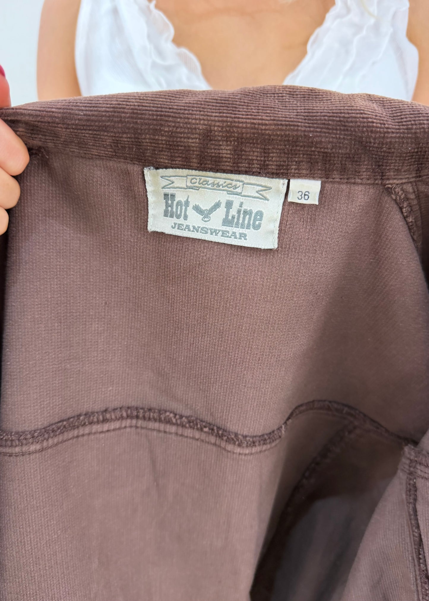 small brown corduroy jacket label