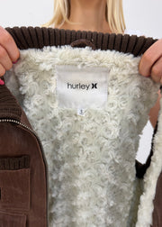 small brown hurley utility gilet label