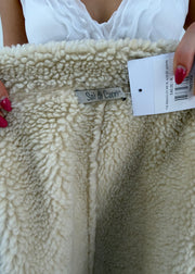small cream suede shearling coat label