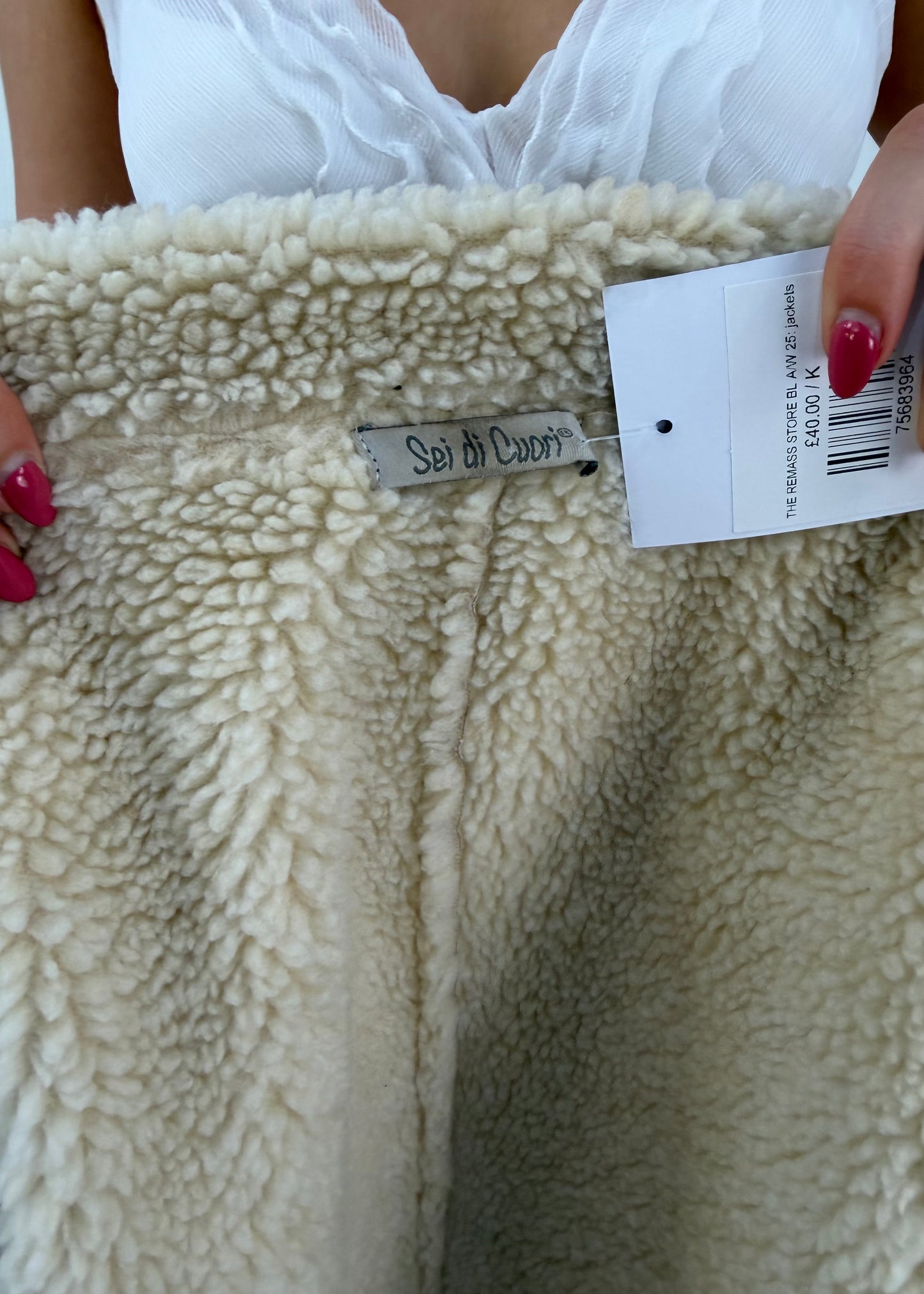 small cream suede shearling coat label