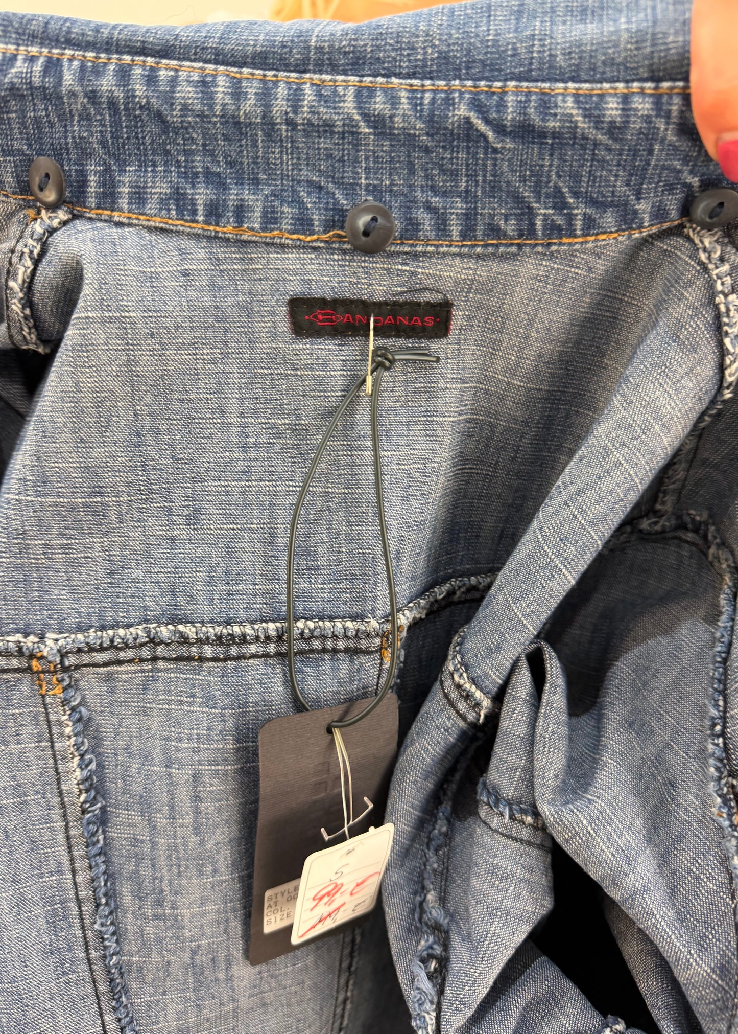 small blue denim longline coat label