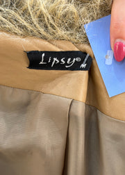 medium tan afghan coat label
