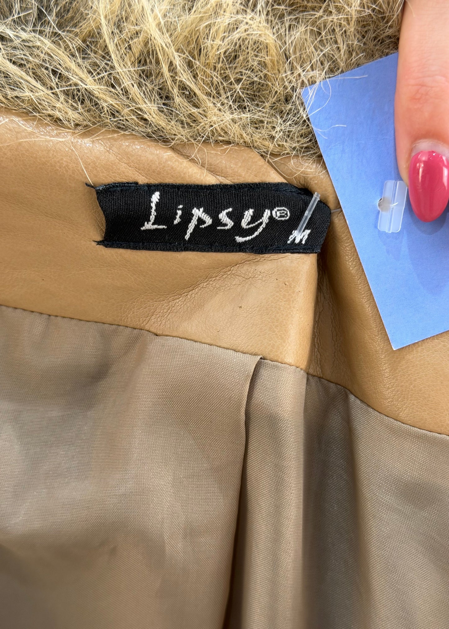 medium tan afghan coat label