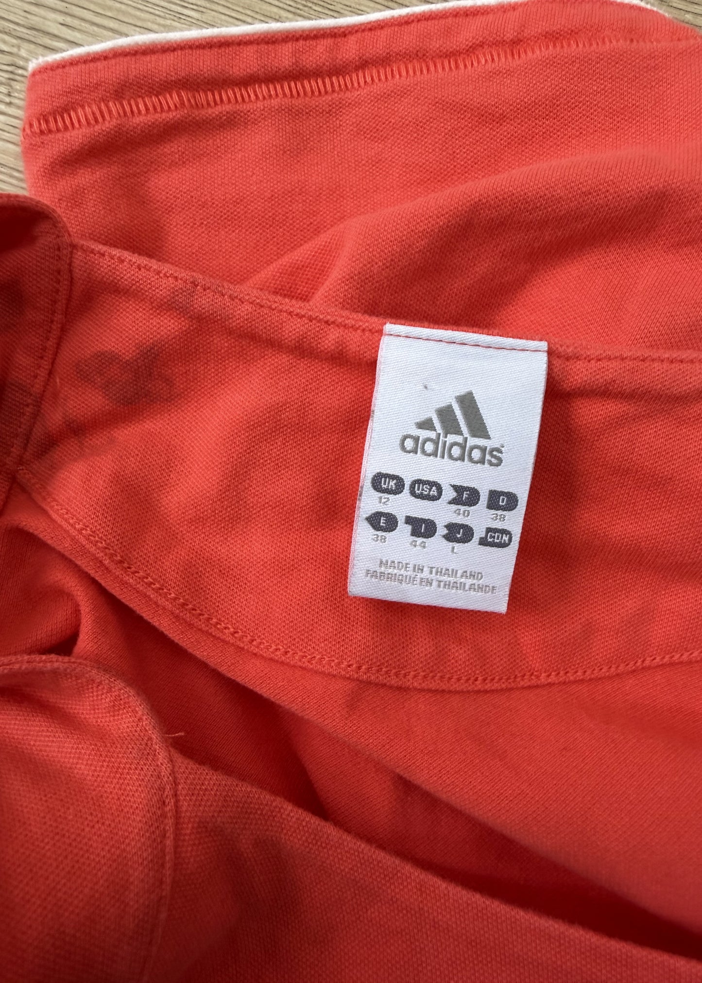 medium orange adidas tank top label