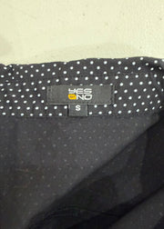small black plaid top with pink ribbon detail care label