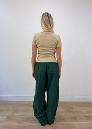 small green cargo trousers back view