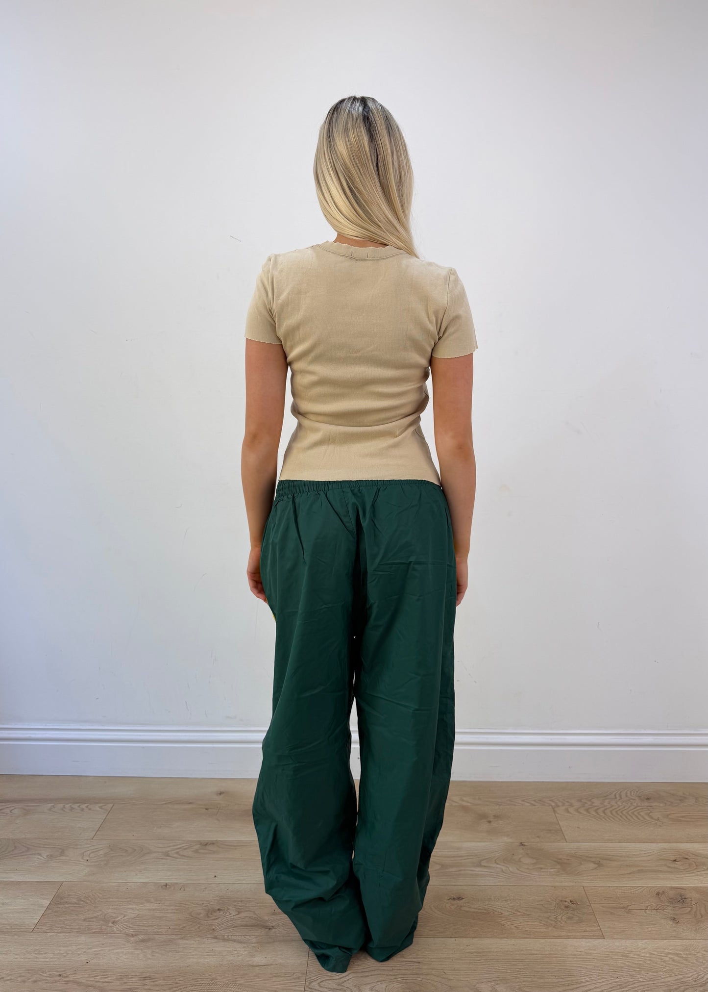 small green cargo trousers back view