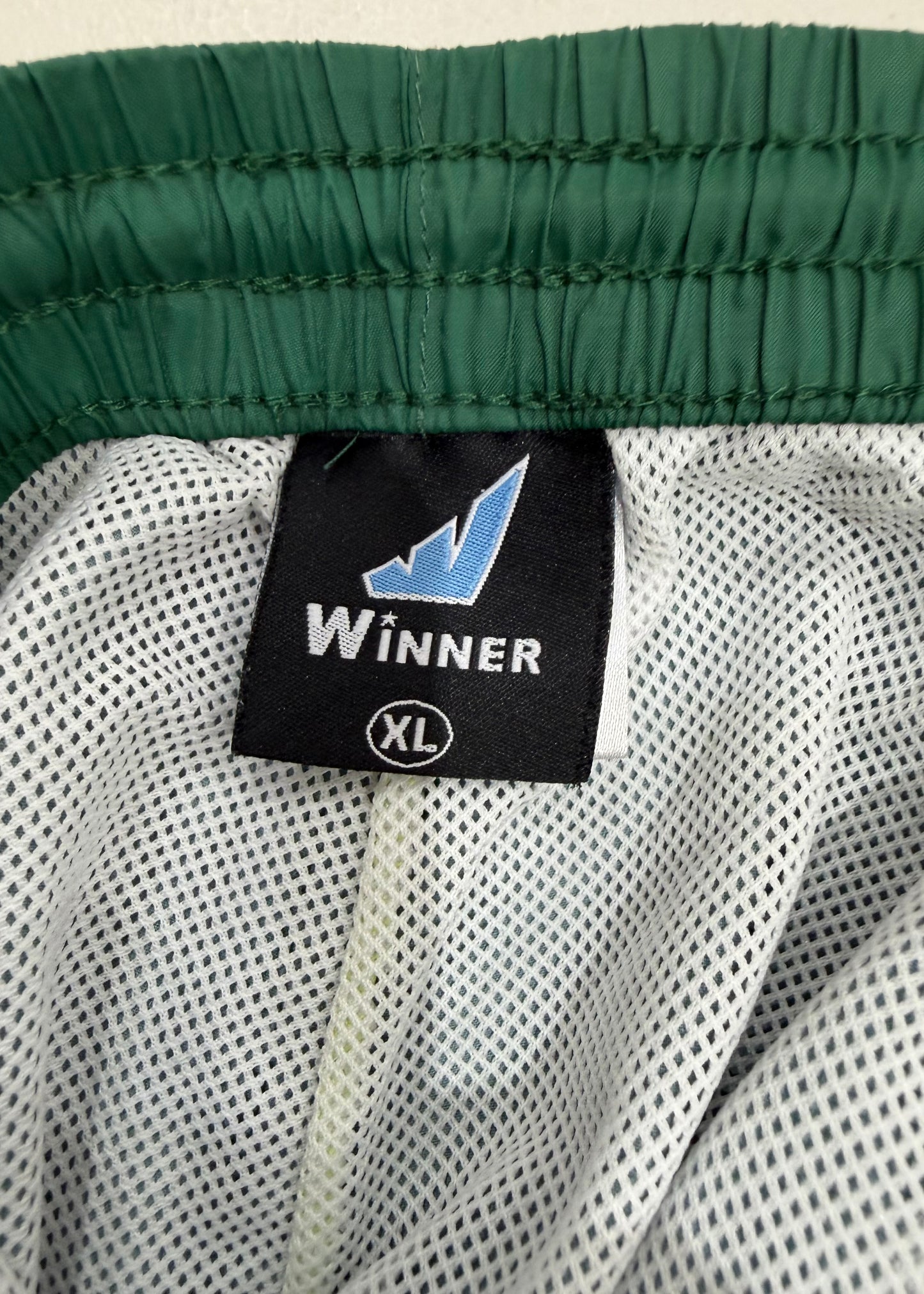 small green cargo trousers care label