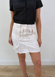 Small cream mini skirt with pocket details
