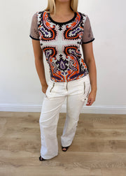 small custo barcelona orange and white patterned top aesthetic headless